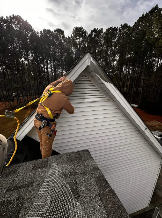 Rapid Wildlife Removal technician performing roof exclusion work